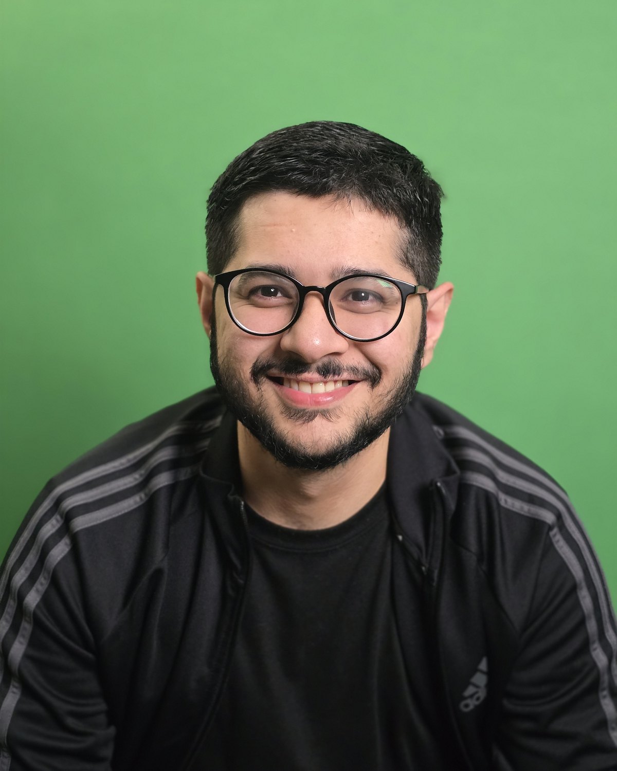 Talha Abrar, co-founder of Dopameme, photographed against a green screen